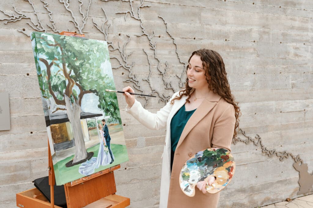 Live wedding painting captures an intimate wedding celebration.