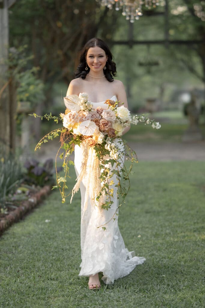  a fairytale bride walks through a chandelier garden