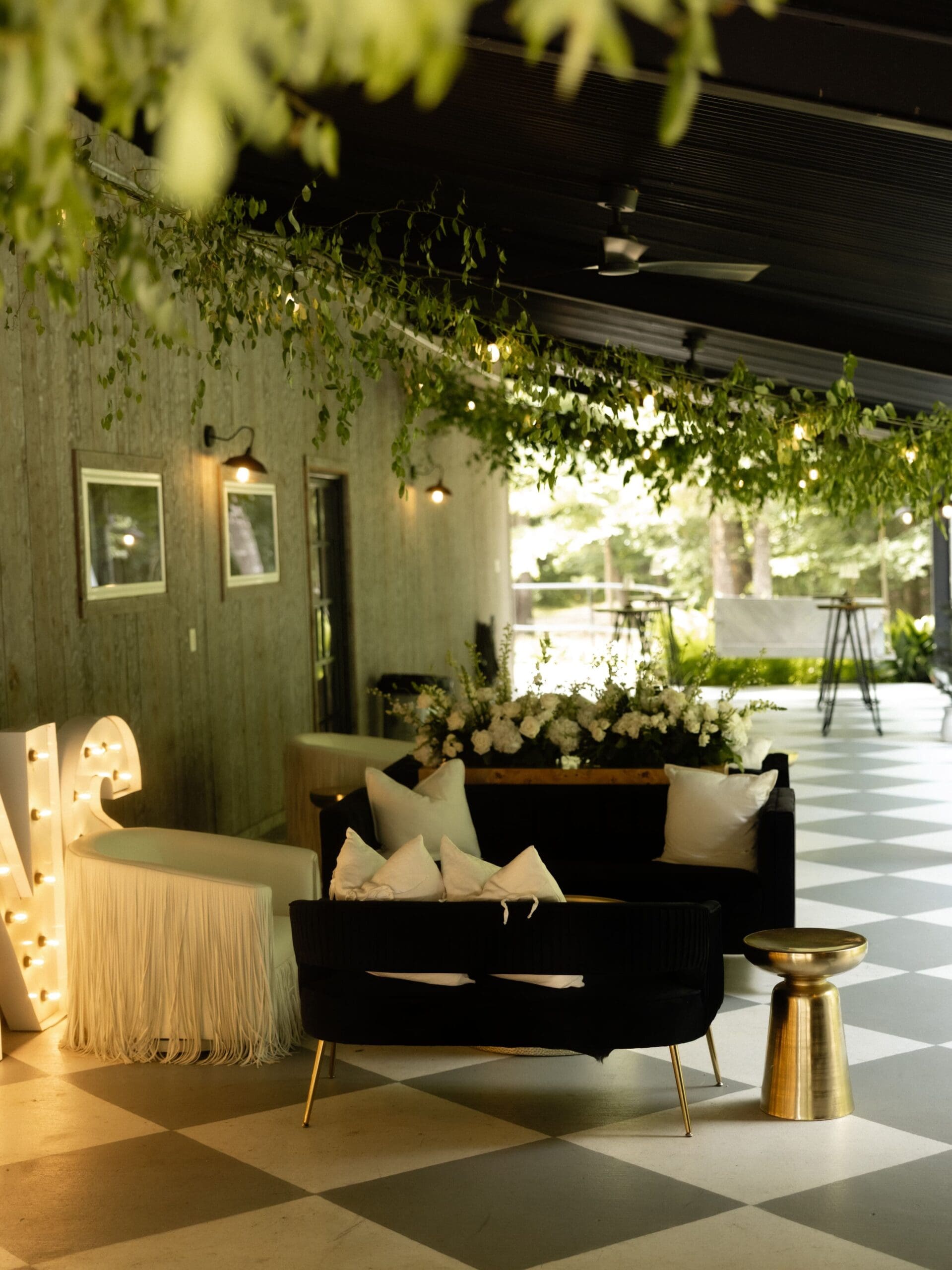 A breezy furnished patio offers a comfortable space for wedding guests to lounge.