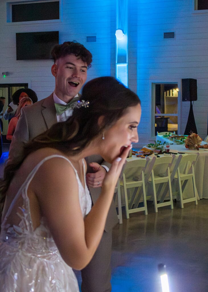 A bride and groom are stunned to see their live wedding painting.