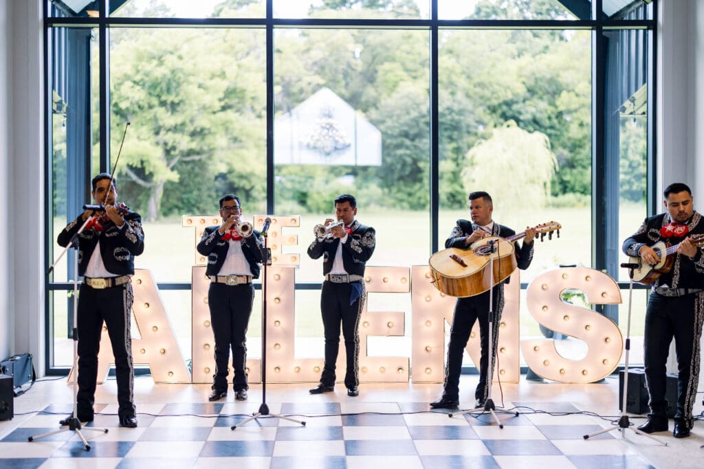 A local mariachi band serenades wedding guests during the reception dinner.